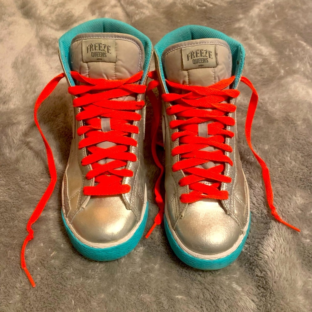 Freeze Queens by Nike addition tennis shoes.